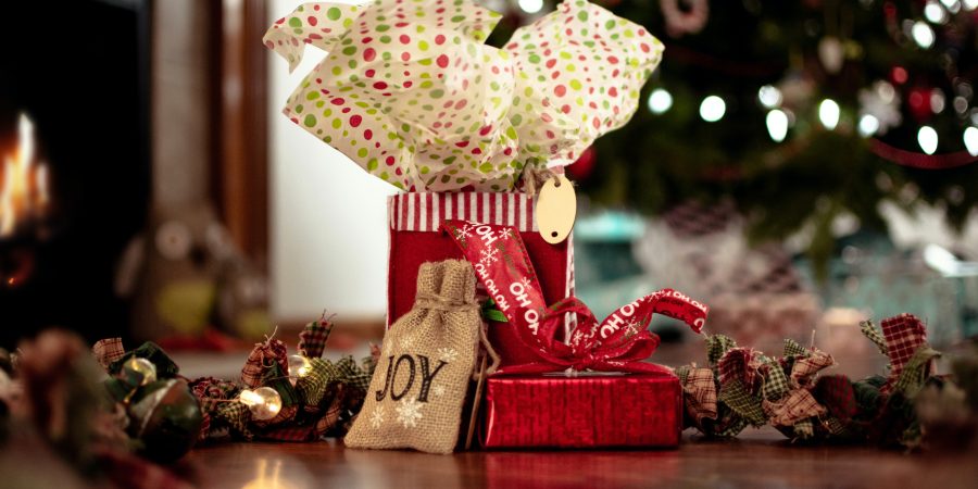 Christmas Gifts for Health Conscious Friends: Pile of wrapped Christmas gifts